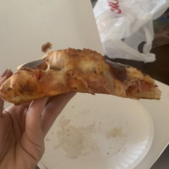 Dion's - A cold old peice of pepperoni pizza. Two peices of chicken on top, a mountain of cheese to cover it. - Pizza Near Me - Albuquerque, New Mexico