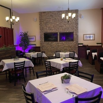 Italio - a dining room with tables and chairs - Argentine Near Me - Las Vegas, Nevada