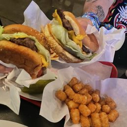 Two single royal burgers, fries and tater tots Two single royal burgers, fries and tater tots