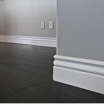 Tricolor Flooring - a dark wood floor with a white trim - Flooring Near Me - Riverview, Florida
