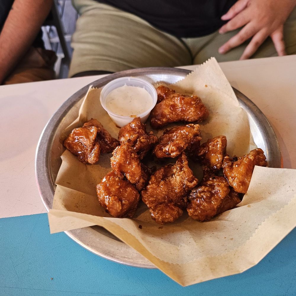 Hooters - a plate of chicken wings with dipping sauce - American Near Me - Daytona Beach, Florida Hooters - a plate of chicken wings with dipping sauce - American Near Me - Daytona Beach, Florida
