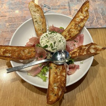 The Lucky Screw - a plate of food with bread and dip - Cocktail Bars Near Me - Fort Myers, Florida