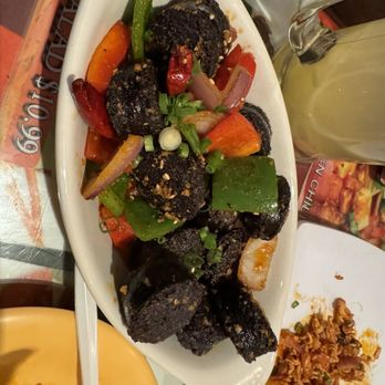 Lhasa Liang Fen - a plate of food and a glass of wine - Chinese Near Me - Elmhurst, New York