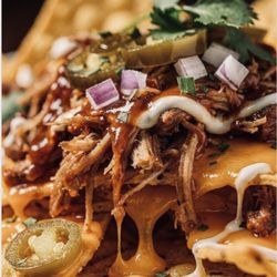 Orleans on Main Bistreaux - Barbecue nachos with queso, chopped red onions, jalapeños