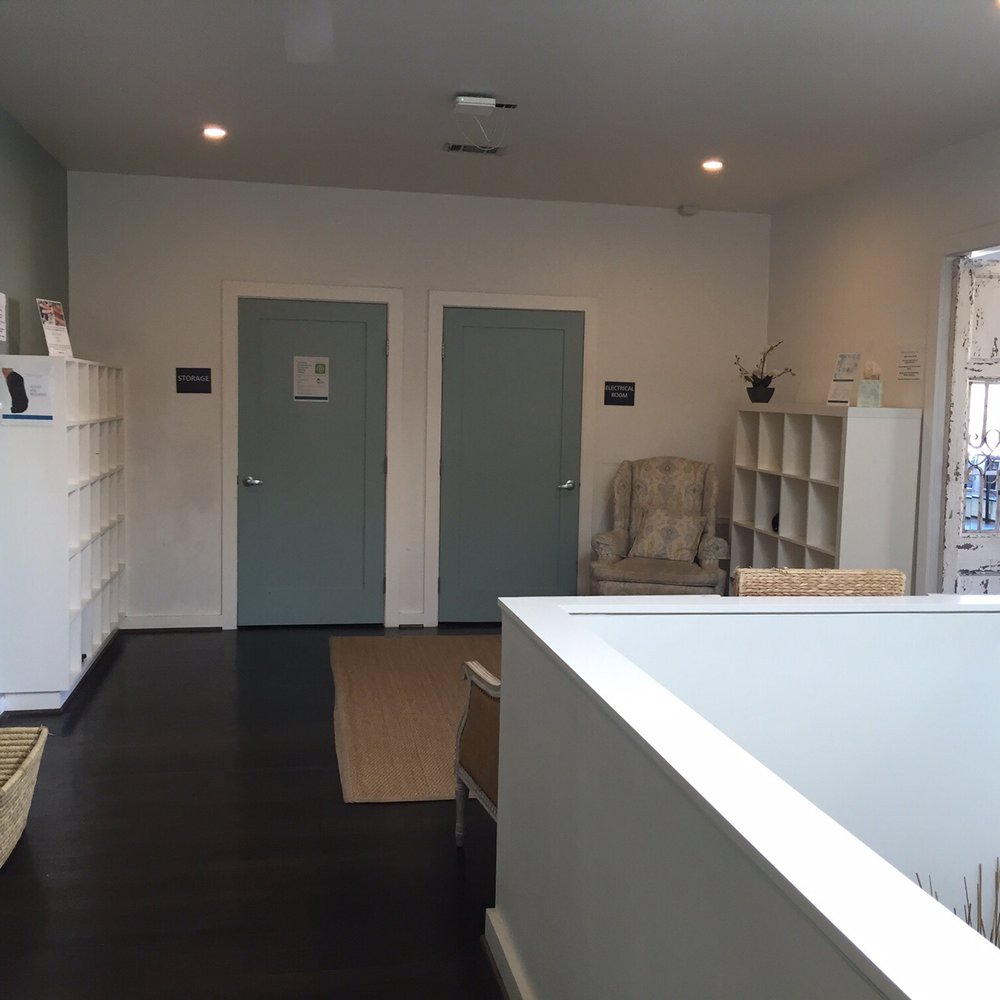DEFINE body & mind - View of the upstairs lobby that connects the "Body/barre" and "Mind/yoga" studios, complete w/ cubbies & towels. - Barre Classes Near Me - Houston, Texas