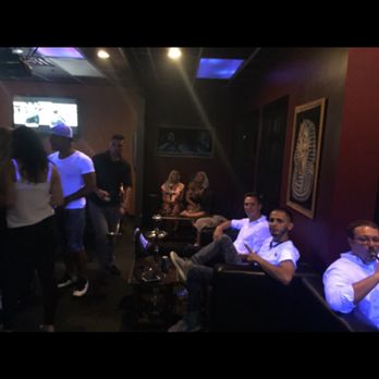 Ramsey's Hookah Lounge - a group of people sitting in a room - Hookah Bars Near Me - Buffalo, New York