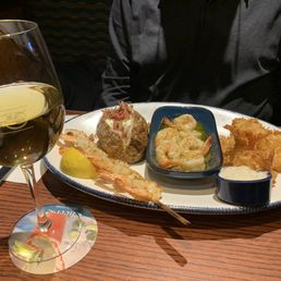 Three kinds of shrimp - grilled shrimp skewer, butter-garlic shrimp, coconut shrimp Three kinds of shrimp - grilled shrimp skewer, butter-garlic shrimp, coconut shrimp