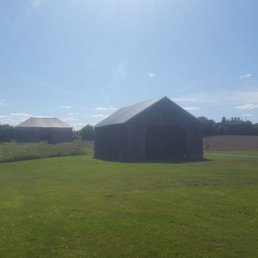 1870's corn crib in the front with the 1790's stone barn in the back.