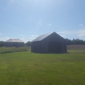 Monocacy National Battlefield - 1870's corn crib in the front with the 1790's stone barn in the back. - Landmarks & Historical Buildings Near Me - Frederick, Maryland
