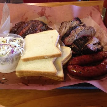 Franklin Barbecue - 2 lbs of ribs, 2lbs of mix lean and fatty brisket, 2 sausages, complimentary white bread, pickles n' onions. - Barbeque Near Me - Austin, Texas