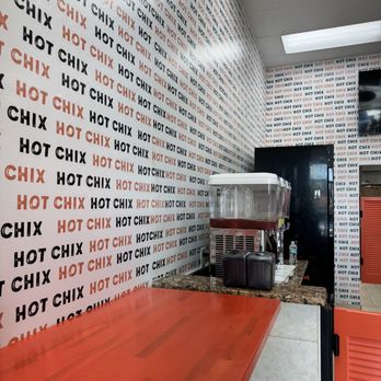 Hot Chix - a red table in a restaurant - Chicken Shop Near Me - Tampa, Florida