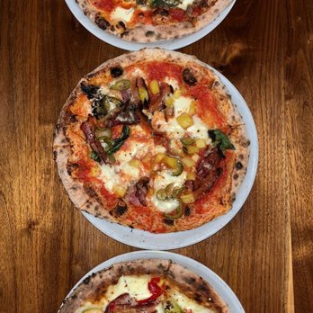 Pizza Brutta - Rossa (sausage, roasted fennel, chiles) Maui Wowie (pineapple, jalapeños, basil) Bianca (Brussels sprouts, smoked bacon, chiles) - Pizza Near Me - Madison, Wisconsin Pizza Brutta - Rossa (sausage, roasted fennel, chiles) Maui Wowie (pineapple, jalapeños, basil) Bianca (Brussels sprouts, smoked bacon, chiles) - Pizza Near Me - Madison, Wisconsin