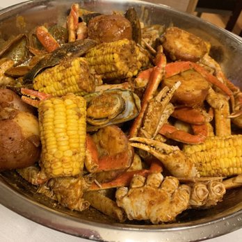 Ragin Cajun Seafood - a bowl of crab legs, corn, potatoes, and corn on the cob - Cajun/Creole Near Me - Madison, Wisconsin Ragin Cajun Seafood - a bowl of crab legs, corn, potatoes, and corn on the cob - Cajun/Creole Near Me - Madison, Wisconsin