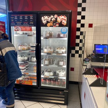 Cold Stone Creamery - a man standing in front of a freezer - Ice Cream & Frozen Yogurt Near Me - Eagle River, Alaska