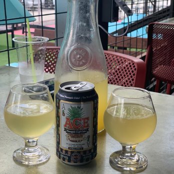 Moonshine Deck - Pineapple mimosa and pineapple cider - American Near Me - Houston, Texas