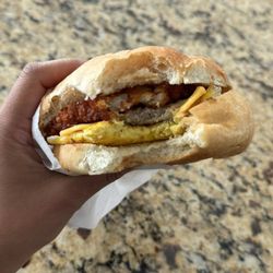 Clarence Delicatessen - Sausage, egg, and cheese, add a hashbrown