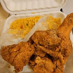Sharks Fish & Chicken - 4 piece... should be ALL dark... 2 are white. Oh. And some "Cajun rice"  The 2 minute microwave kind.