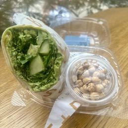 Nashville Hot Kale wrap from the fridge. With fresh cucumber, zippy sauce and baked chickpeas - yum!! Nashville Hot Kale wrap from the fridge. With fresh cucumber, zippy sauce and baked chickpeas - yum!!