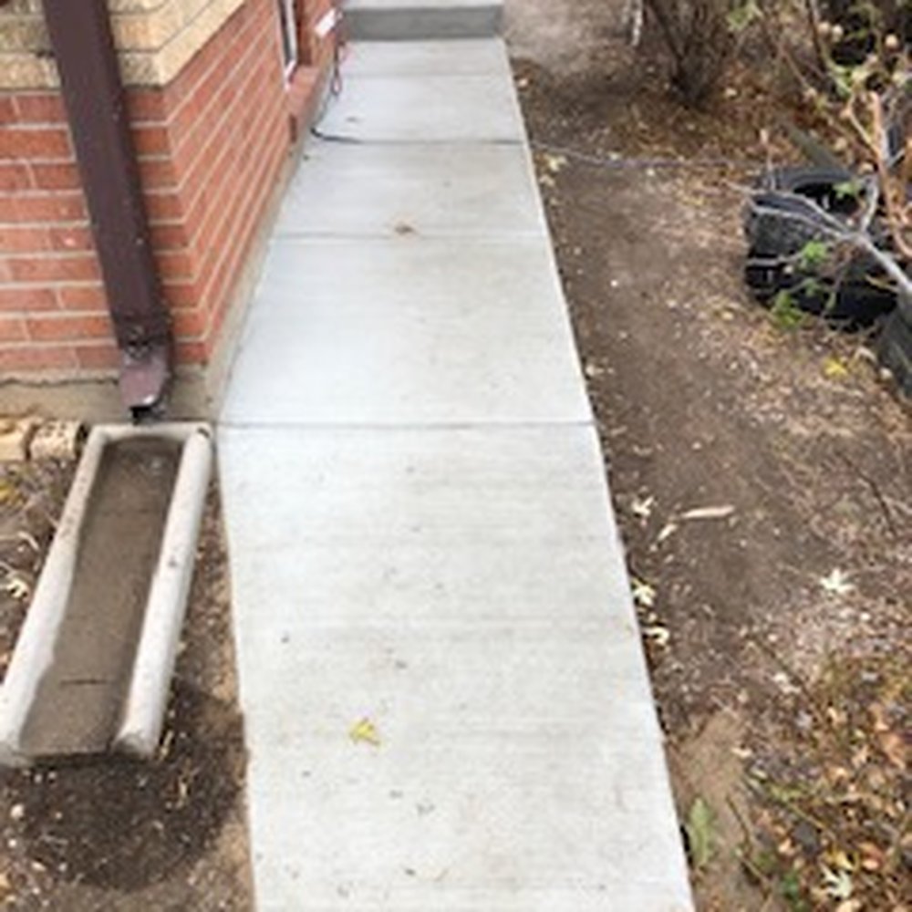 Denver Concrete - Back sidewalk connected to the new sidewalk leading to the new stoop. (The black thing is not a flaw; it's an extension cord.) - Masonry/Concrete Near Me - Denver, Colorado Denver Concrete - Back sidewalk connected to the new sidewalk leading to the new stoop. (The black thing is not a flaw; it's an extension cord.) - Masonry/Concrete Near Me - Denver, Colorado