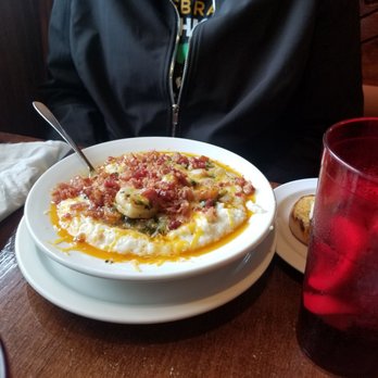 Molly Brown's Cafe - Shrimp and Grits southern style, delicious! Chpped Spinach, onion, bacon, cheddar cheese, cajun seasoning. - Breakfast & Brunch Near Me - Cuyahoga Falls, Ohio