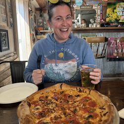 Zuccaro's Kitchen - Pepperoni and mushroom pie with red pepper cream sauce and a cup filled with the beer on tap