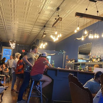 Winehouse at 127 - people sitting at a bar - Beer Bar Near Me - Post, Texas Winehouse at 127 - people sitting at a bar - Beer Bar Near Me - Post, Texas