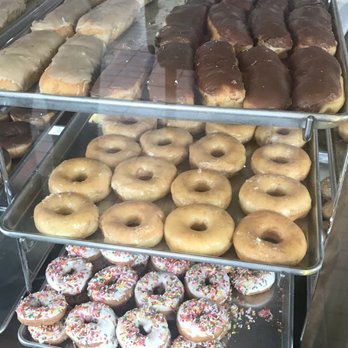 Baker Ben's Donuts - Donuts in their display case, I'm a sucker for maple bars, so I'll be back! - Donuts Near Me - Roseville, California