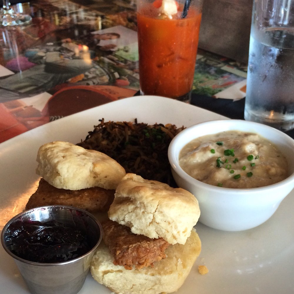 The Fiction Kitchen - Chicken biscuits with a side of gravy and a Bloody Mary. - Vegan Near Me - Raleigh, North Carolina The Fiction Kitchen - Chicken biscuits with a side of gravy and a Bloody Mary. - Vegan Near Me - Raleigh, North Carolina