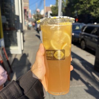 Happy Lemon - a person holding a glass of lemonade - Taiwanese Near Me - Flushing, New York Happy Lemon - a person holding a glass of lemonade - Taiwanese Near Me - Flushing, New York