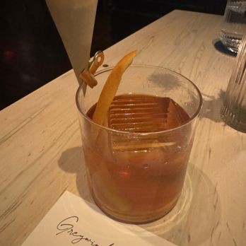 Greywind - old fashioned- toffee popcorn, keeper's heart irish + bourbon, carpano, orange bitters - Wine Bars Near Me - New York, New York Greywind - old fashioned- toffee popcorn, keeper's heart irish + bourbon, carpano, orange bitters - Wine Bars Near Me - New York, New York