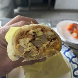 Alfonso's Mexican Food - Nice breakfast burrito. Rolled tightly and perfect.