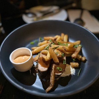 Traif - a plate of food on a table - New American Near Me - Brooklyn, New York Traif - a plate of food on a table - New American Near Me - Brooklyn, New York