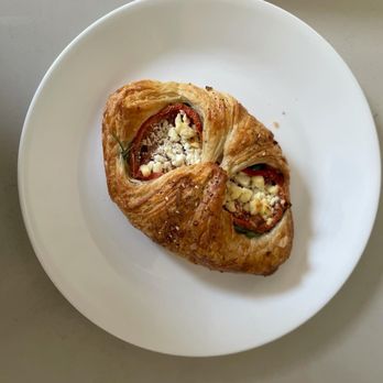 Sunflour Baking Company - a croissant on a plate - Bakeries Near Me - Harrisburg, North Carolina