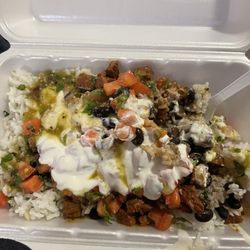 Mi Casa Tu Casa - Steak bowl with white rice, black beans, pico de gallo, queso, sour cream, and medium salsa