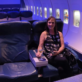 PS Air - Here is the wife, enjoying her first-class seating and a glass of vino. - Cocktail Bars Near Me - Palm Springs, California