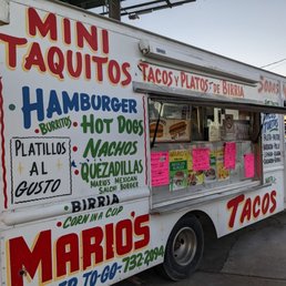 a food truck parked on the side of the road a food truck parked on the side of the road