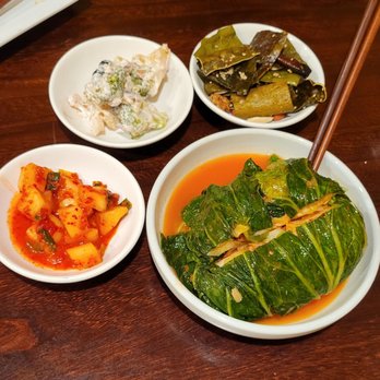 Yong Su San - Left: Radish Kimchi; Middle: Mayo Vegetable Salad; Right: Fried Kelp Chip; Bottom: Kaesung Bossam Kimchi - Korean Near Me - Los Angeles, California