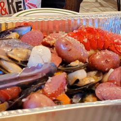 Hook & Reel Cajun Seafood & Bar - Lobsters, 1 lb mussels, 1 lb clams, 1 lb clams, sausages, red potatoes, sweet corn on the cob