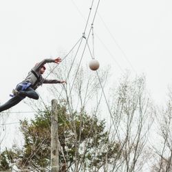La Vida Adventure Pursuits - Our most challenging element is the leap of faith. Climbers ascend and stand on top of a pole, then leap off the pole to hit the boy.