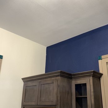 Gold Medal Builders - a kitchen with a blue accent wall - General Contractors Near Me - Orange, Texas