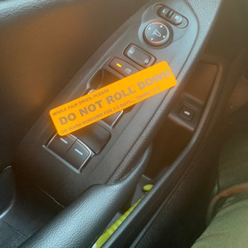 Doral Tinting - Warning sign not to open scroll window - Car Window Tinting Near Me - Miami, Florida