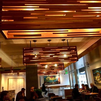 Tender Greens - Interior.  Warm wood ambiance w cool lights. Check out my review! - New American Near Me - Pasadena, California