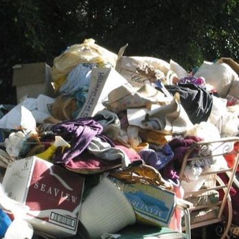 Clay's Clean Up - a pile of trash outside - Landscaping Near Me