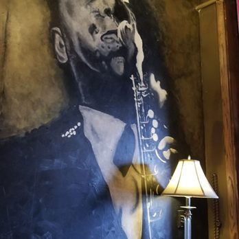 Charlies Bar & Kitchen - One of the Charlie portraits on the wall. This one was Charlie Parker. - Cocktail Bars Near Me - Bronx, New York Charlies Bar & Kitchen - One of the Charlie portraits on the wall. This one was Charlie Parker. - Cocktail Bars Near Me - Bronx, New York