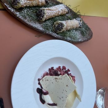 Carrello - Traditional cannolis and a panna cotta with white chocolate, lemon sorbet, and raspberry sauce! - Italian Near Me - Seattle, Washington Carrello - Traditional cannolis and a panna cotta with white chocolate, lemon sorbet, and raspberry sauce! - Italian Near Me - Seattle, Washington