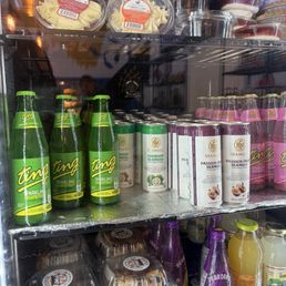 Fridge with drinks and desserts. Carrot cake, red velvet cake, chocolate cake, etc Fridge with drinks and desserts. Carrot cake, red velvet cake, chocolate cake, etc