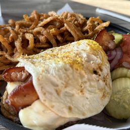 Onion rings and Big D burger with fried egg on top Onion rings and Big D burger with fried egg on top