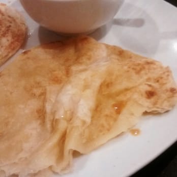 Coco Garden - The coconut milk flavor was amazing! The Roti Canai tpically comes with one of the doughy discs, but we ordered extra: large crew. - Malaysian Near Me - Rochester, New York