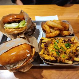 Bacon cheeseburger, gruyere + caramelized onion burger, chili cheese fries, and onion rings.