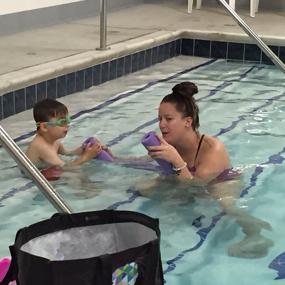 Miss Kelly making the pool noodle "talk" to my son. Miss Kelly making the pool noodle "talk" to my son.